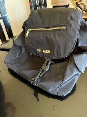 Steve Madden Black Nylon Flap Drawstring Backpack with Gold Hardware